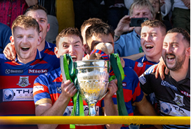A delighted Calum Grant about to lift the 2024 Camanachd Cup for Kingussie. 2024 Tulloch Homes Camanachd Cup Final - Lovat v Kingussie, played at An Aird, Fort William.  