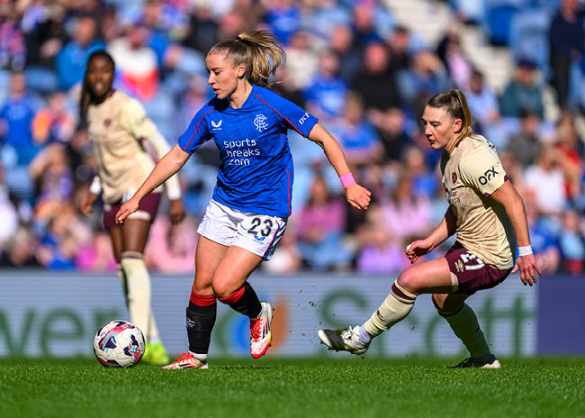 Kirsty MacLean of Rangers holds off Naomi Powell of Hearts during the ScottishPower Women's Premier League 1 match between Rangers Women and Hearts Women at Ibrox Park, Glasgow, Scotland on  30 March 2025.  Picture Malcolm Mackenzie / ScottishPower Women’s Premier League  All photo usage must carry mandatory copyright credit (© ScottishPower Women’s Premier League | Malcolm Mackenzie)